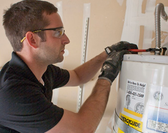 one of our techs is repairing a water heater in Kendall West